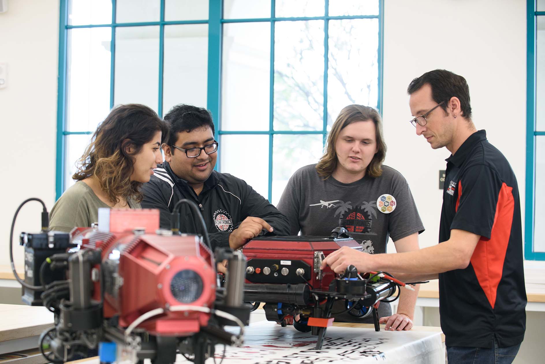 Engineering students work on a motor