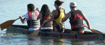 Four students rowing a boat