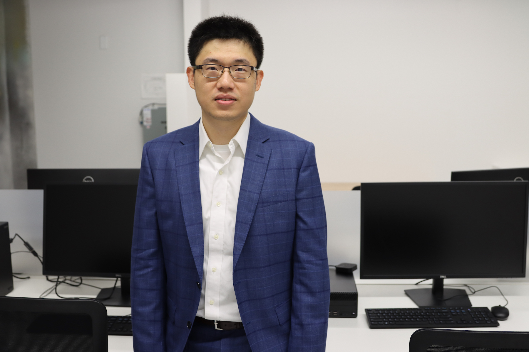 Assistant Professor Huang in his computer laboratory