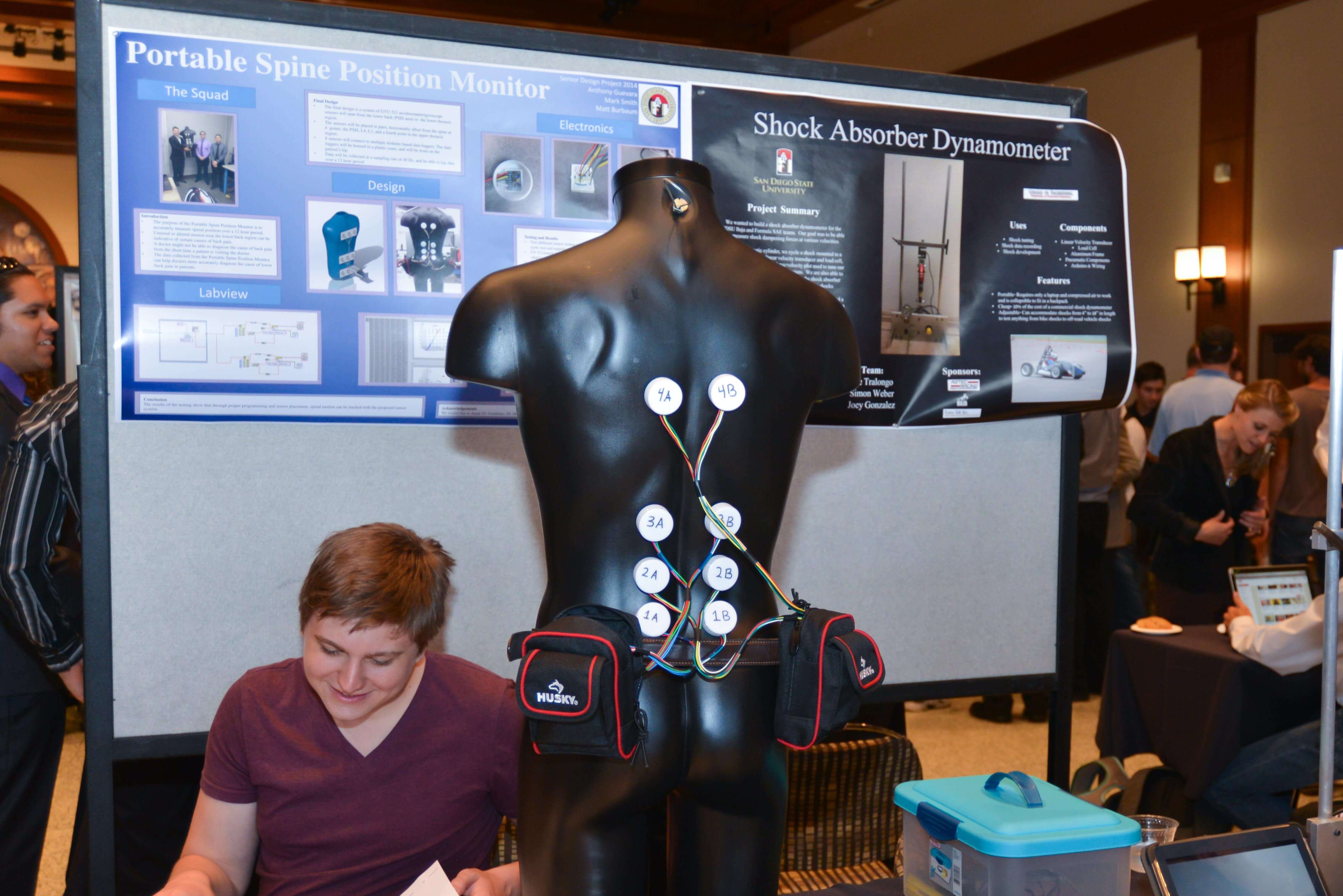 Black mannequin torso with student.