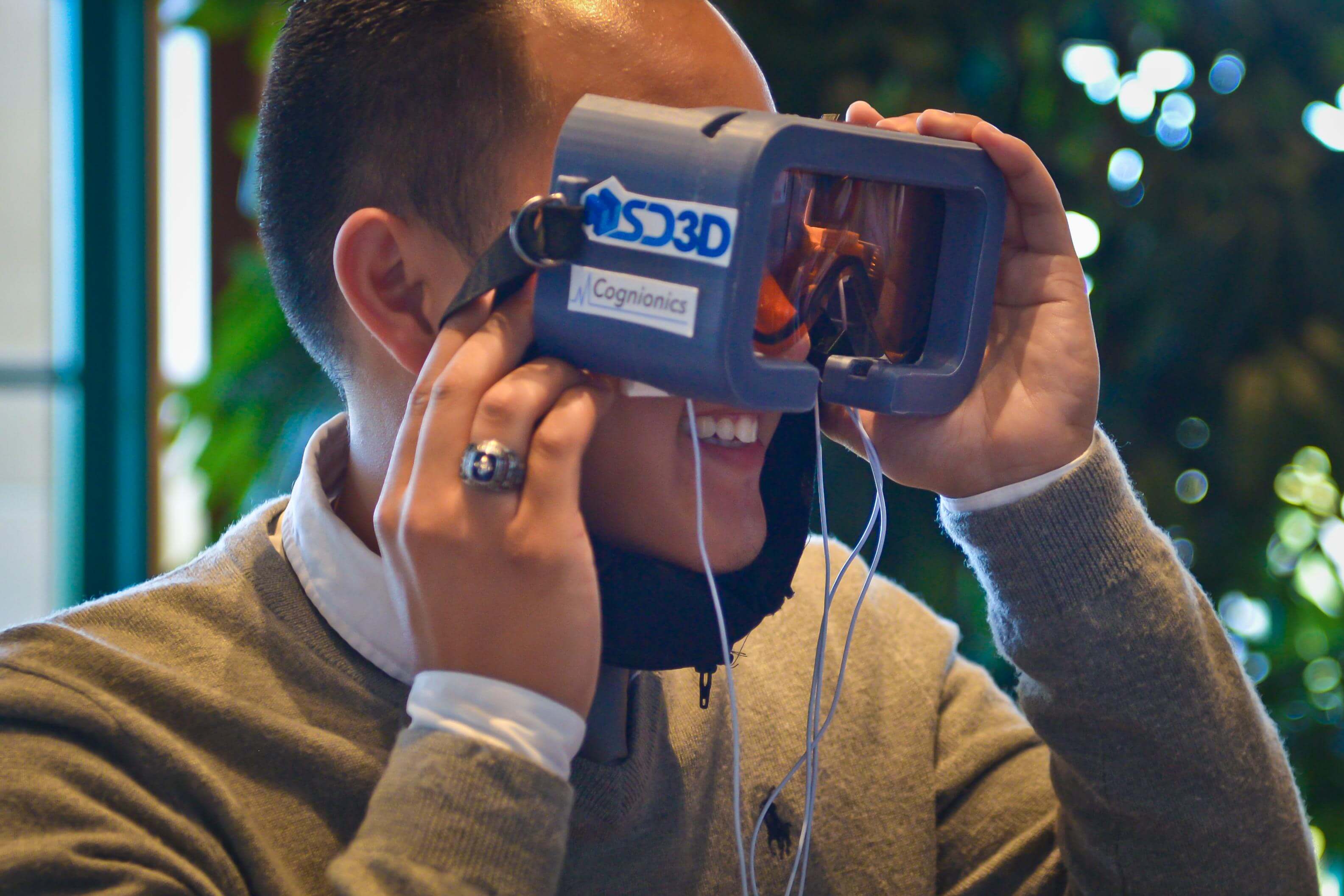 Man looks through a virtual reality project.