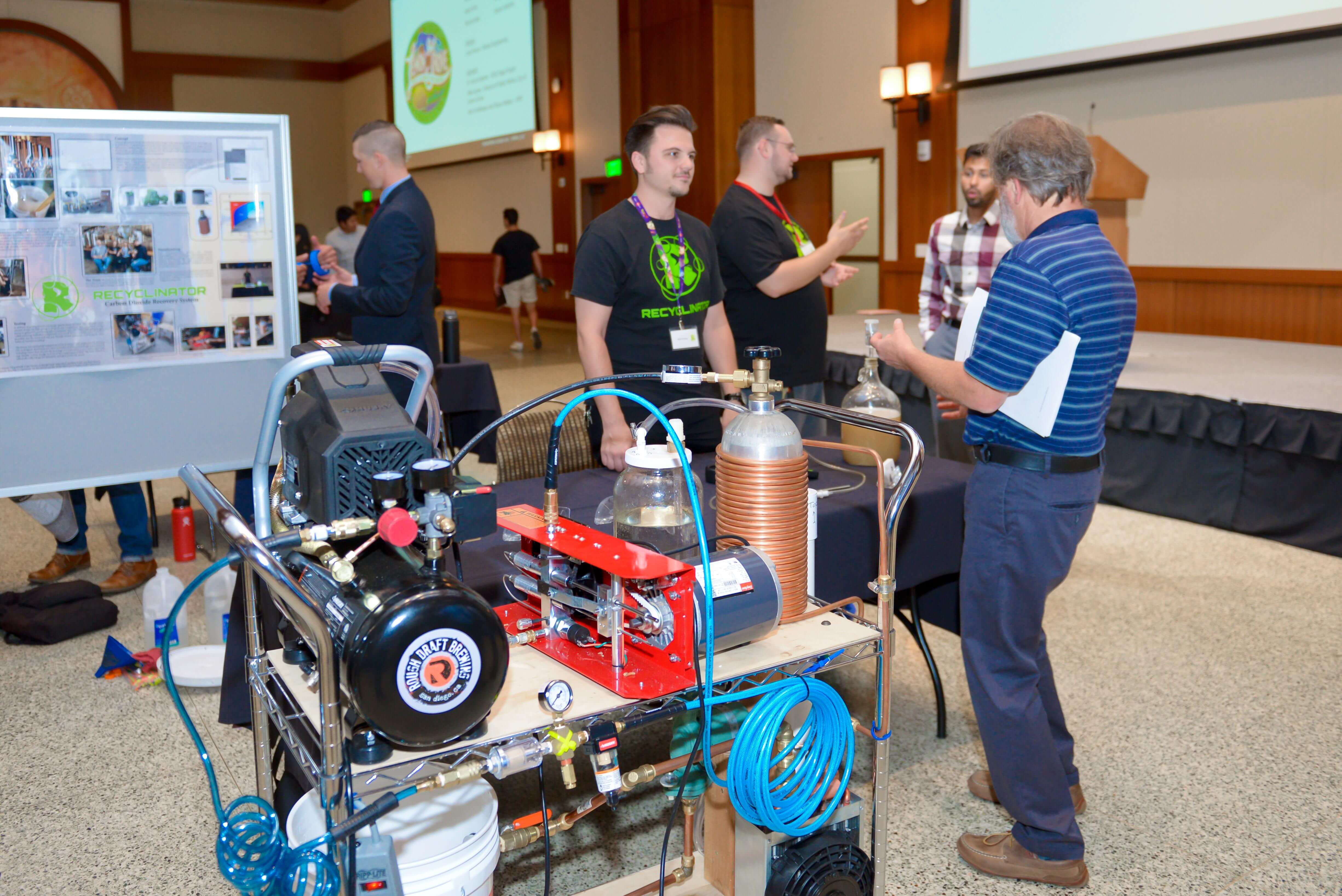 Student showing a faculty member how their project works.