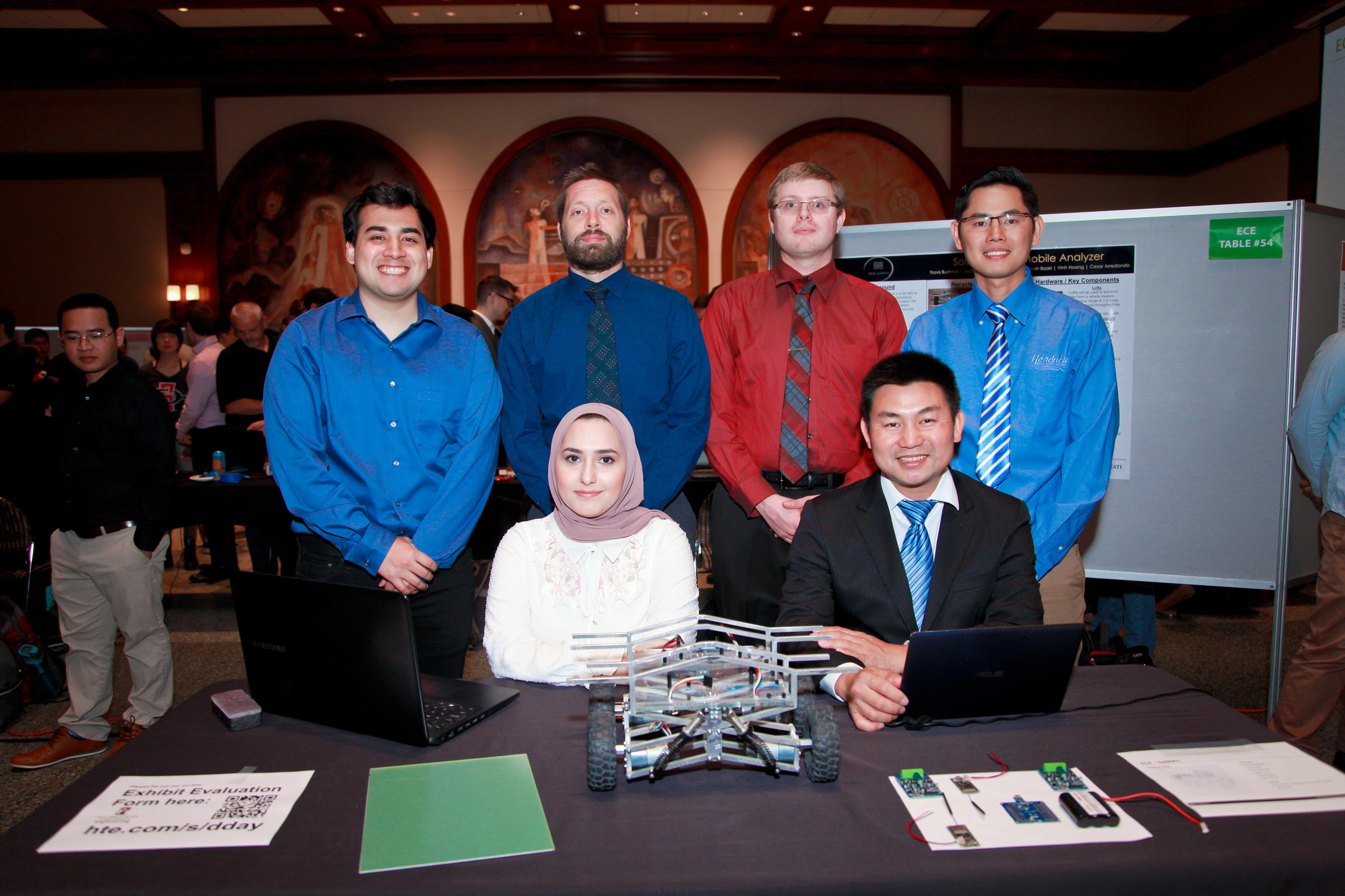 team members posing with project