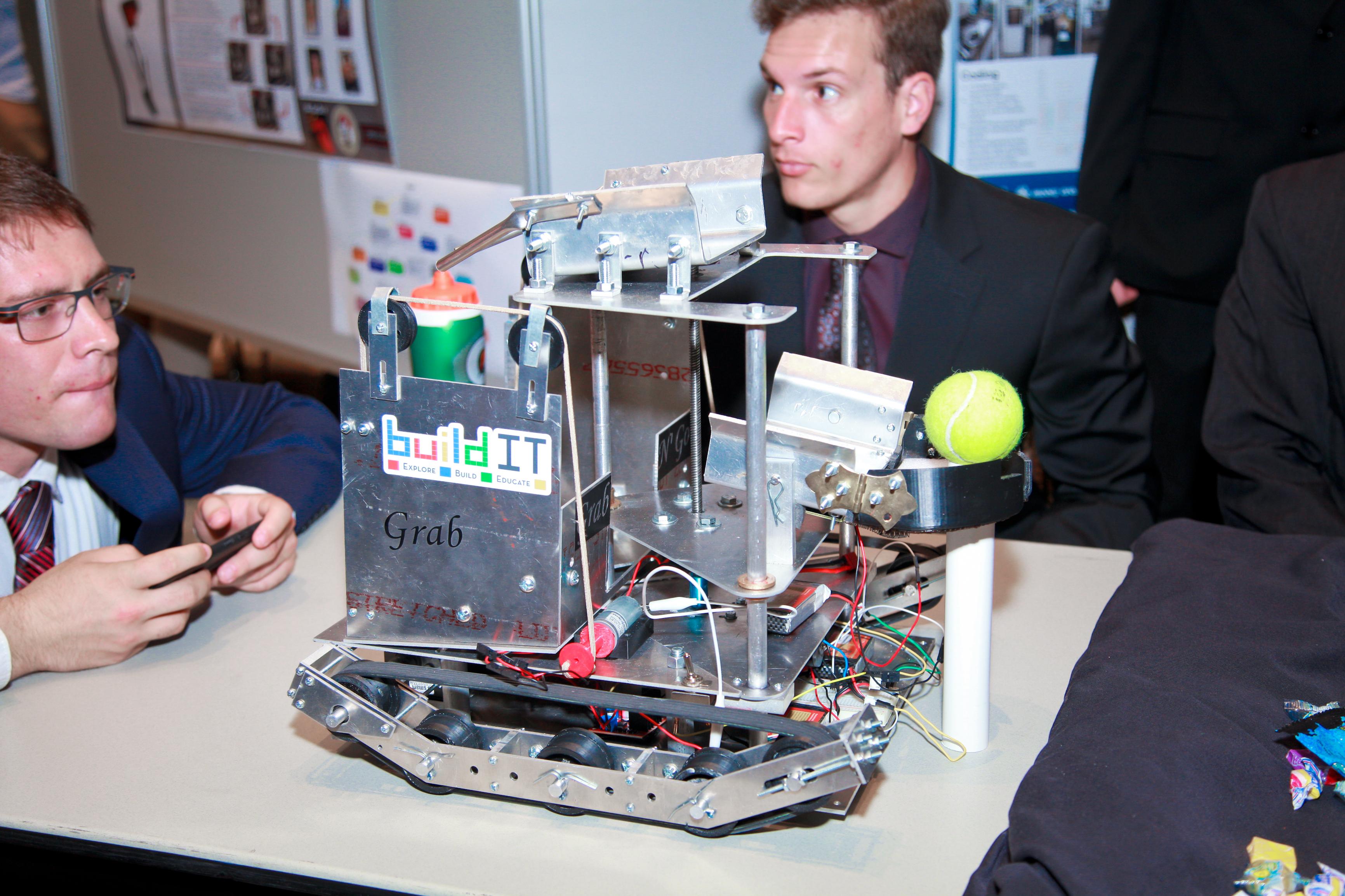 students demonstrating robot project