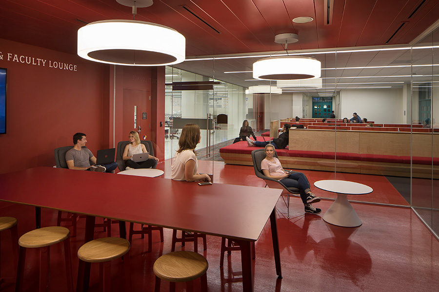 Students studying and talking in the Faculty and Staff Collaboration Room.
