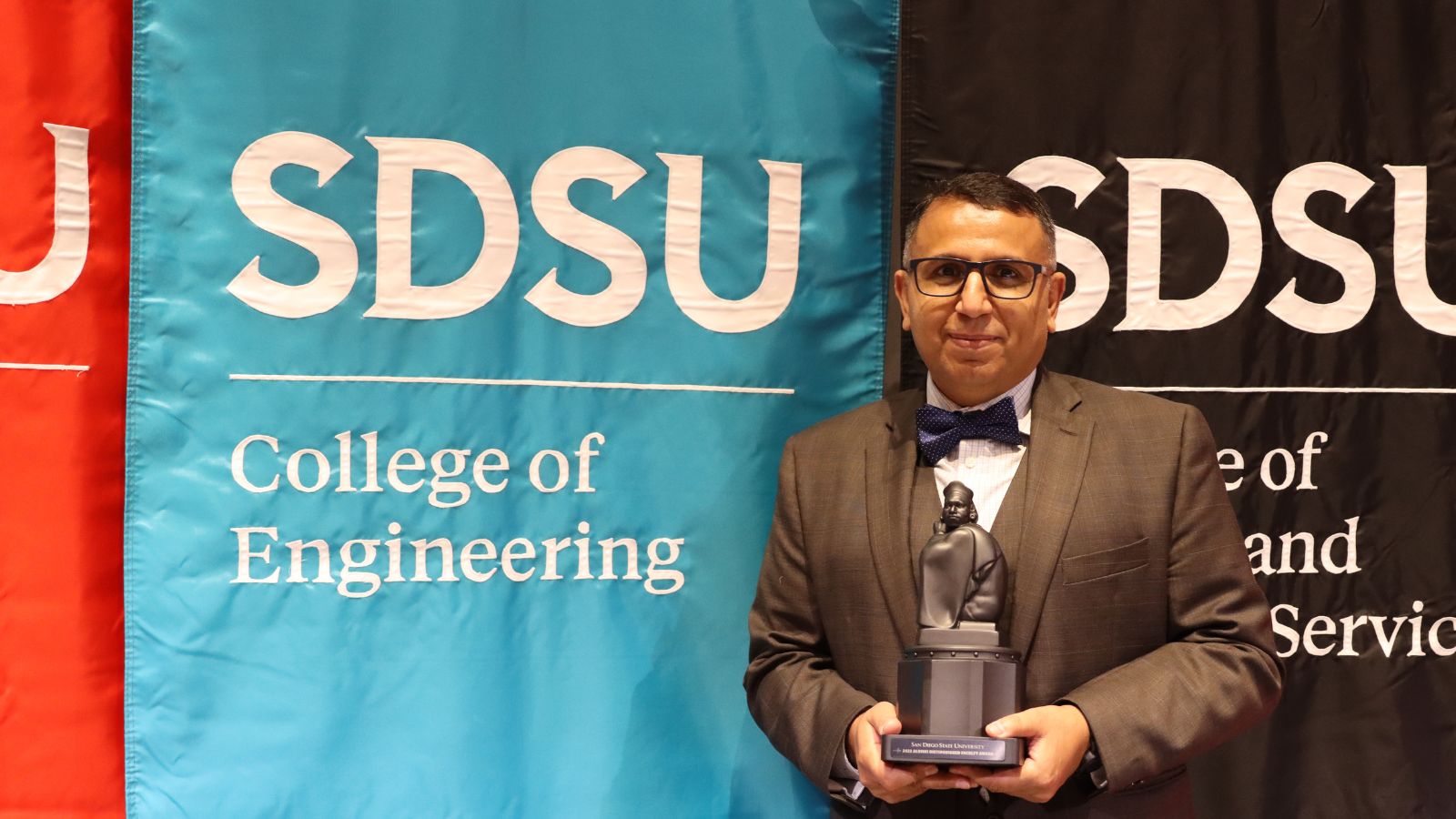 Dr. George Youssef posing with his award