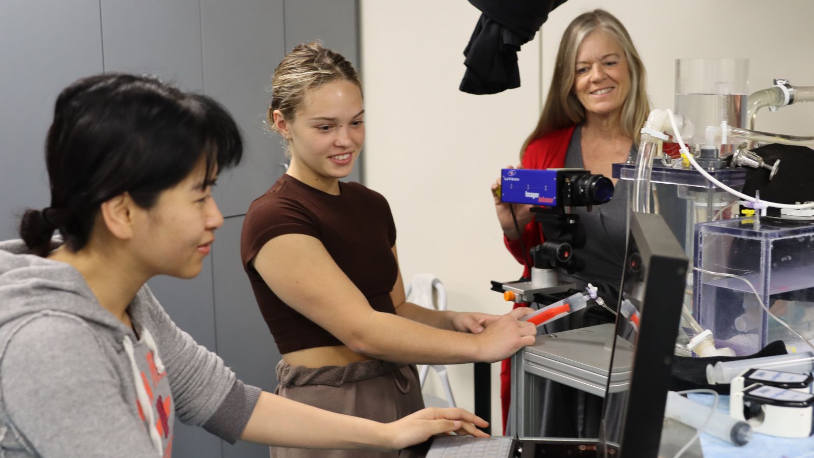 Karen May-Newman (center) poses with postdoctoral researcher Vi Vu (left) and undergraduate researcher Britton Mennie in the Cardiovascular Bioengineering Lab.