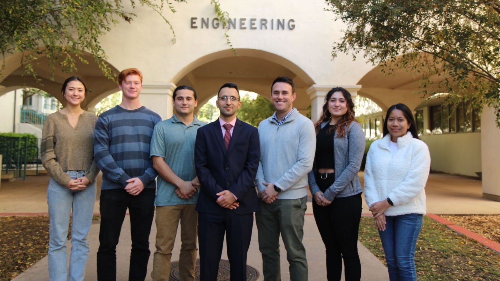 Hassan Davani (center) poses with his team of Urban Water Lab student researchers.