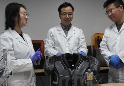 From left: SDSU doctoral student Qingqing He, Assistant Professor of mechanical engineering Yang Yang and USC graduate student Yushun Zeng in the laboratory. 