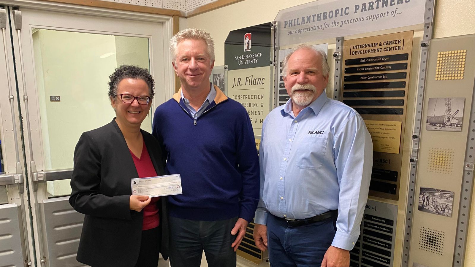 Pictured L-R: Thais Alves (Professor and AGC - Paul S. Roel Chair in Construction Engineering and Management), Mike Crawford (Chairman of Board at Sukut Construction), Marc Filanc (CEO of J.R. Filanc Construction)