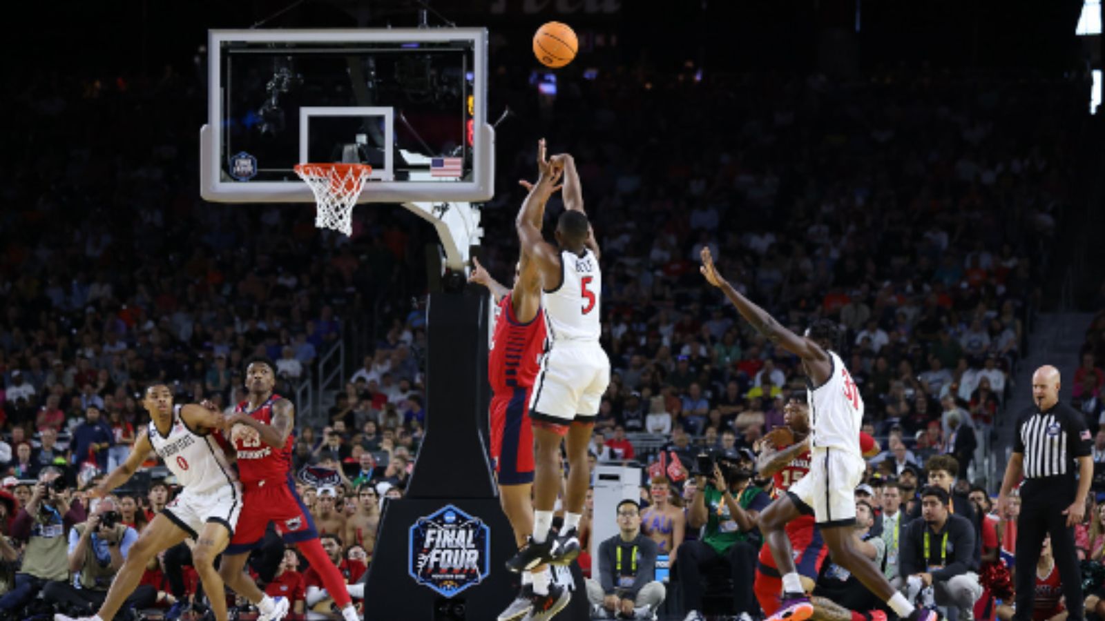 SDSU guard Lamont Butler attempts a shot over an FAU defender during their Final Four game at NRG Stadium in Houston, Texas, Saturday, April 1, 2023. (SDSU)
