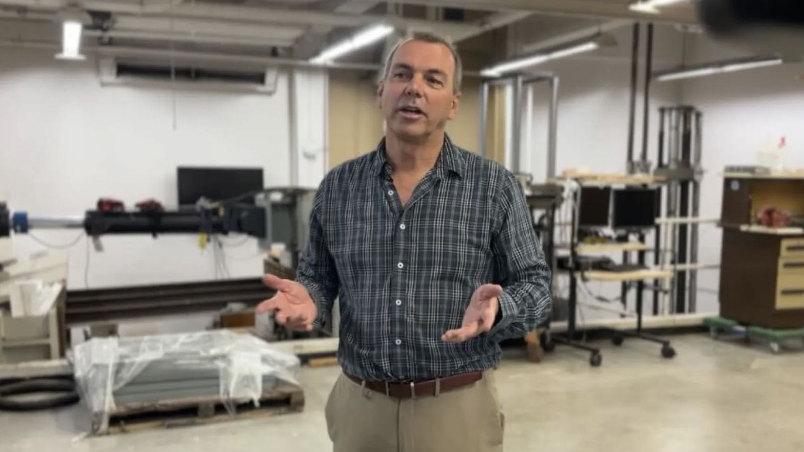 Engineering professor Robert Dowell speaks in San Diego State University's Structural Engineering Laboratory. May 12, 2023