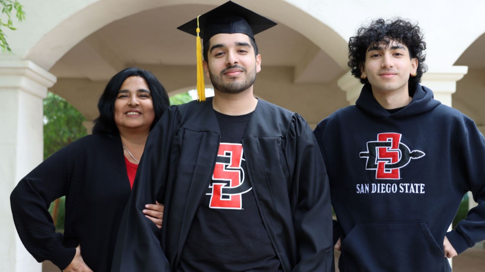 Janet (left), Danny, and Miguel Tisnado stand outside of the Engineering building. (Melinda Sevilla/SDSU)
