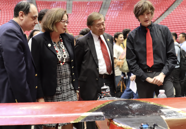 Left to right: College of Engineering Dean Olevsky, SDSU President Adela de la Torre, SDSU Interim Provost Dr. William Tong, and Aerospace Engineering student at 2024 Senior Design Day 